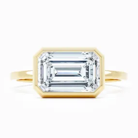 Bezel-Set East-West -  Emerald Cut Engagement Ring