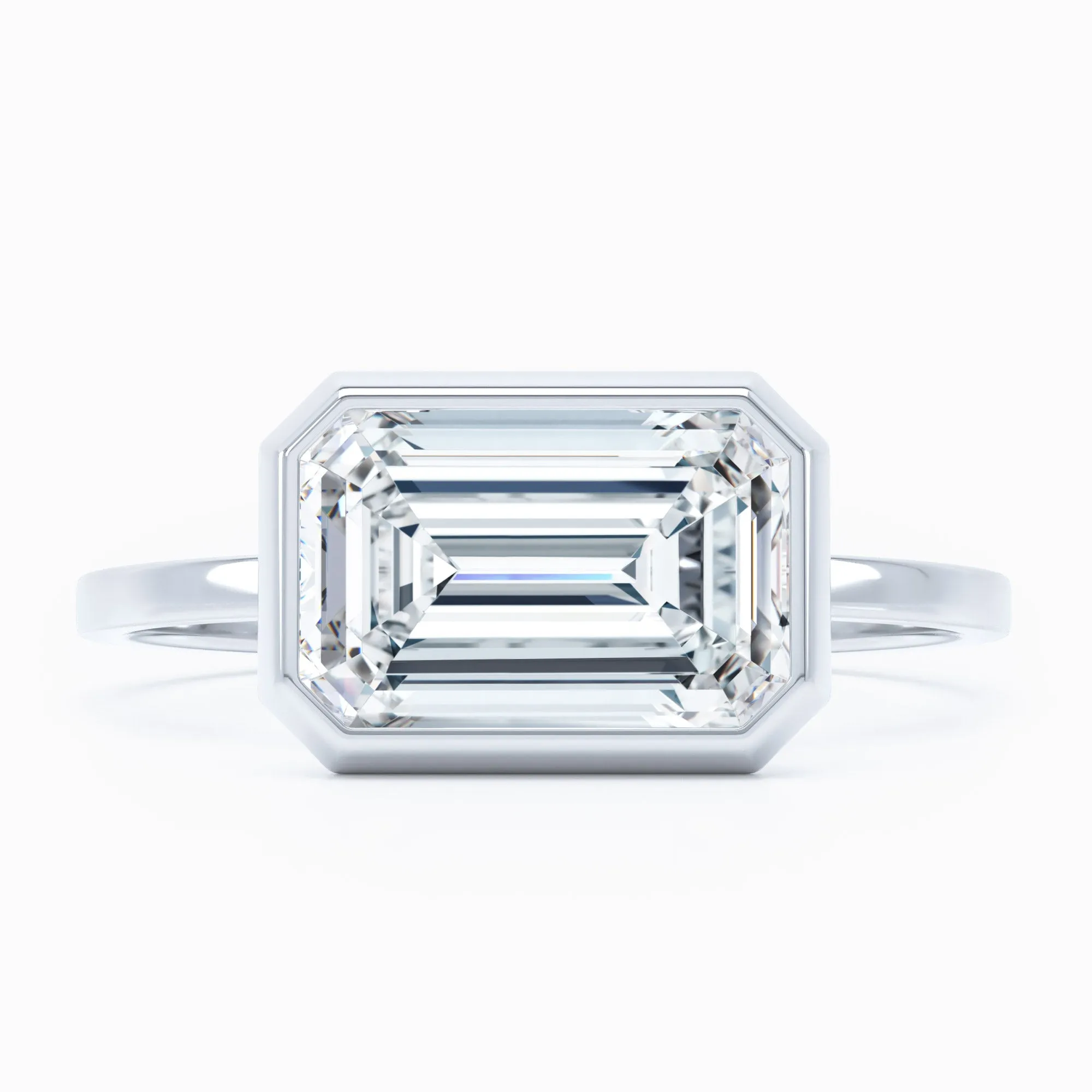 Bezel-Set East-West -  Emerald Cut Engagement Ring